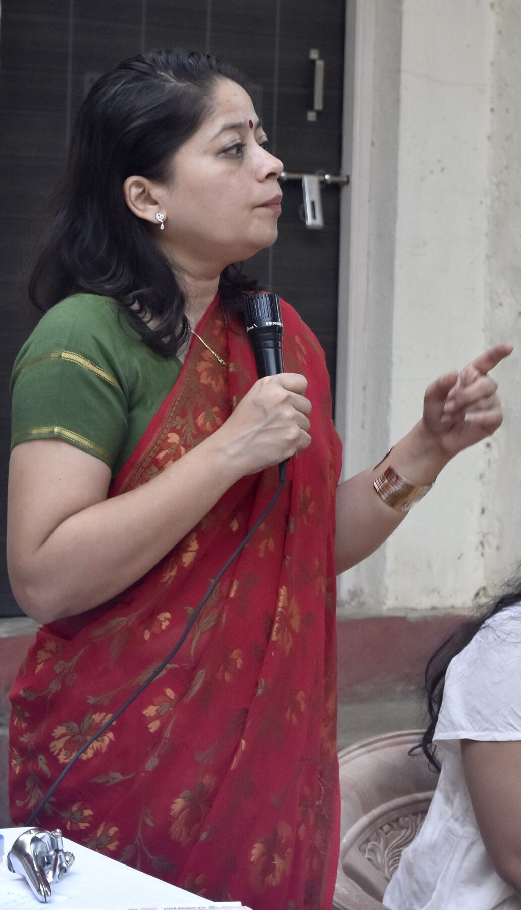 Dr. Anjali Talwalkar presenting at a women's health awareness seminar